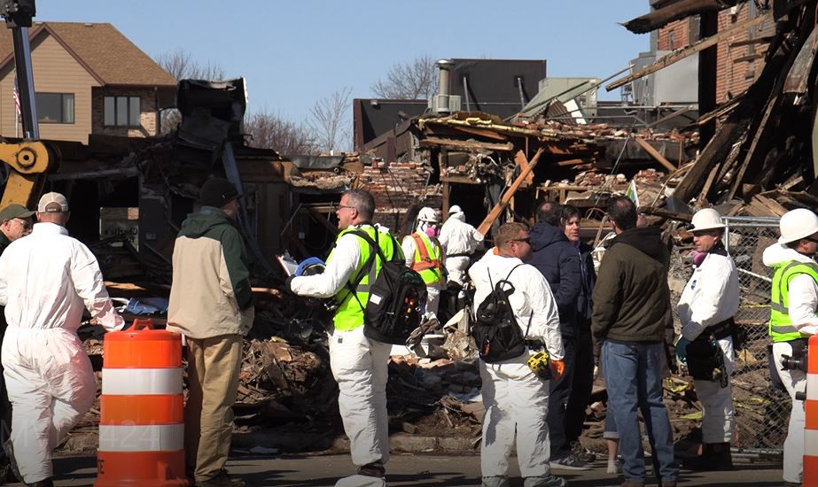 Investigators are combing through the rubble of downtown Alexandria fire